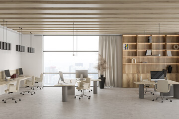 Light office interior with pc computer and work desk near panoramic window