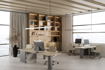 Wooden business interior with pc computer and work desk near panoramic window
