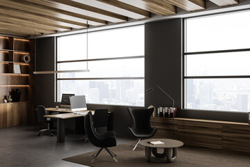 Dark office interior with chill zone and panoramic window on skyscrapers