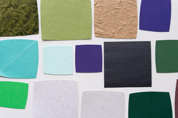 Fototapeta premium collection of roughly square paper shapes on a blank background