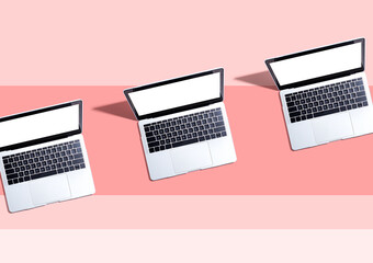 Three laptop computers with shadow