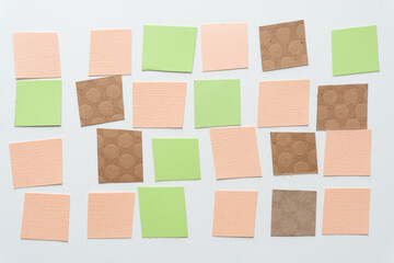paper tiles arranged in a loose grid on blank paper