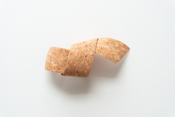 loosely knotted cork ribbon isolated on blank paper