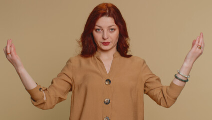 Keep calm down, relax, inner balance. Redhead woman breathes deeply with mudra gesture, eyes...