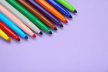 Different colorful markers on light background, space for text