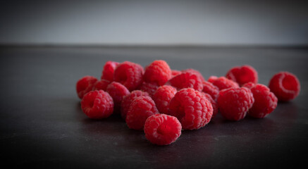 raspberries on black background