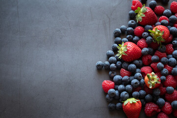 berries on dark wooden background