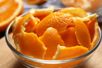 Orange peels preparing for drying on wooden board, closeup