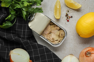 Flat lay composition with tin can of tasty cod liver and different products on textured table