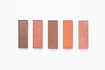 Different beautiful eye shadows on white background, flat lay