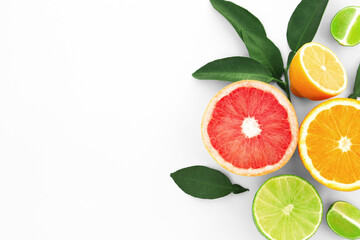 Fototapeta na wymiar Different citrus fruits and leaves on white background, top view