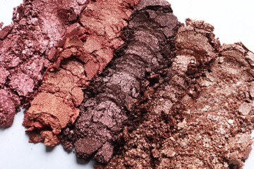 Different crushed eye shadows on white background, top view. Professional makeup product