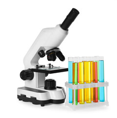 Test tubes with colorful liquids and microscope isolated on white