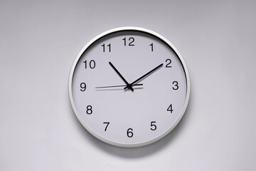 Stylish round clock on white background, top view. Interior element