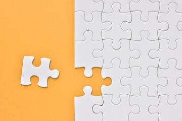 Jigsaw puzzle on a orange background