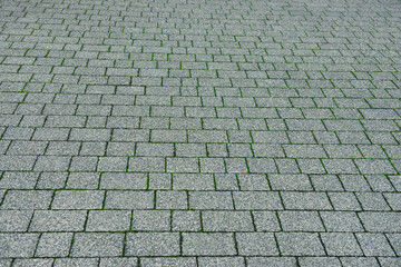 View on grey stone sidewalk. Footpath covering