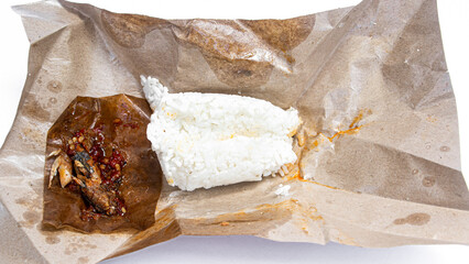 nasi kucing sambal pindang street food from Yogyakarta Indonesia. wrapped in paper. 