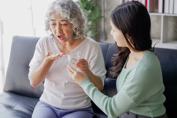 Candid attractive beautiful mum sit at cozy sofa couch living room in family moment grown child kid celebrate joy good warm time kiss relationship with retired overjoy lady girl health life.