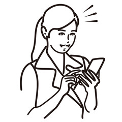 スマホを見て微笑む働く女性