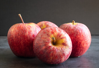 red apples on black background