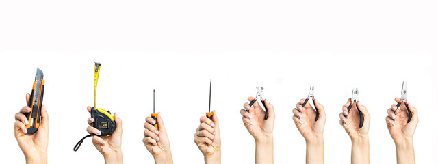 A small hand tool in a woman's hand on a white background.