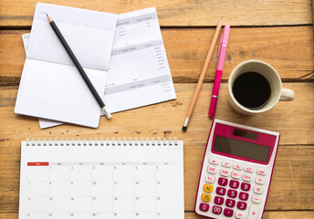 passbook bank, statement, calendar and calculator for business work arrangement flat lay style on...