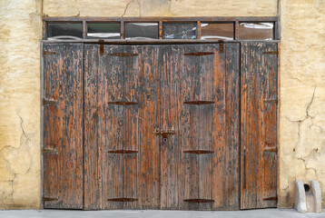 old brown wood door vintage and retro style or ancient house double wooden doors with hinge and...