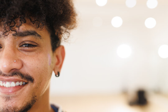 Image of happy biracial male hip hop dancer posing to camera with copy space