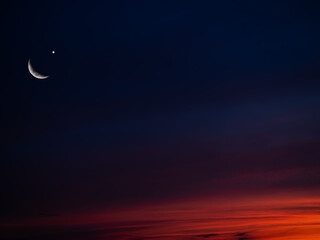 Islamic Background Desing Concept,Crescent Moon and Sky Landscape in Night Sunset Blue Orange for...