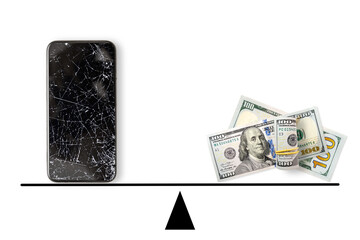 Black broken touch screen phone and 100 dollars banknotes on scales