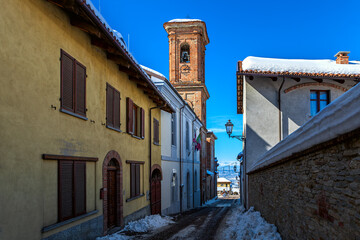 Fototapeta premium Narrow street among old houses in small town in Italy.