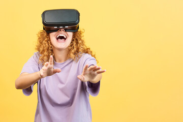 Surprised woman smiling while using virtual reality goggles