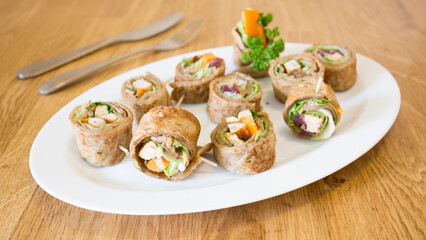 Goraasa roll with vegetables. Goraasa is a Sudanese pancake or flatbread that is fluffy, versatile, soft and doughy.
