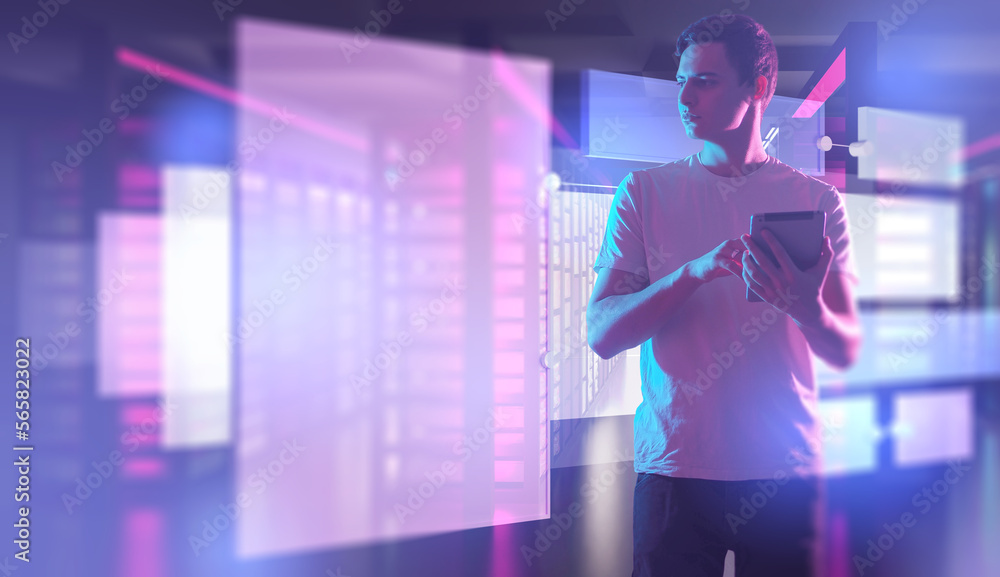 Poster man system administrator. guy with tablet on neon background. panels symbolizing digitalization near