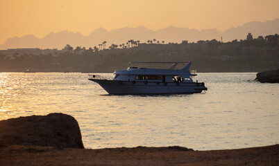 Yacht in the sea at sunset