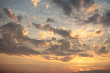 Colorful clouds at sunset as background.