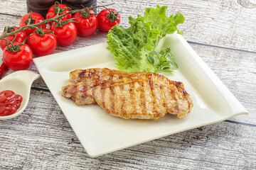 Grilled pork steak with ketchup