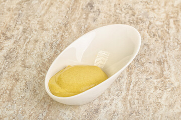 Organic mustard sauce in the bowl