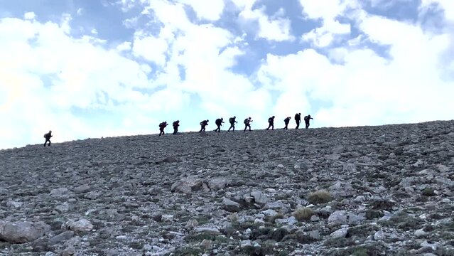 very large crowd mountaineering sport team and hiking for event