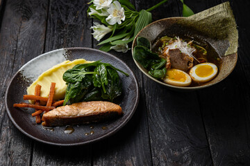 delicious salmon dish on a plate prepared in a restaurant.
