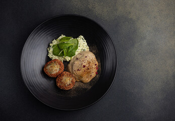 a delicious fish dish on a plate prepared in a restaurant.

