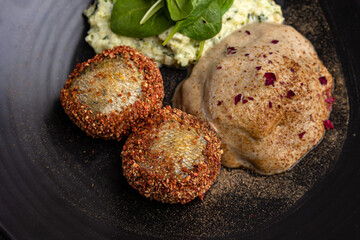 a delicious fish dish on a plate prepared in a restaurant.
