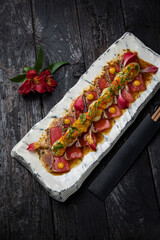 delicious tuna dish on a plate prepared in a restaurant.
