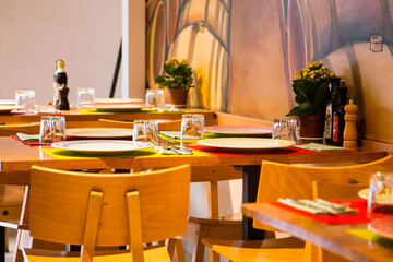 Elegant restaurant table with cutlery, crockery and glasses.