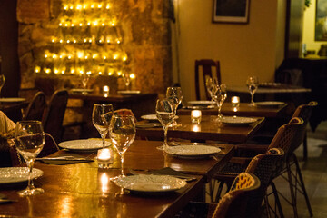 Elegant restaurant table with cutlery, crockery and glasses.