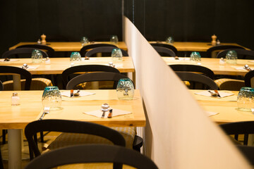 Elegant restaurant table with cutlery, crockery and glasses.