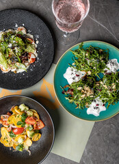 a delicious salad on a plate prepared in a restaurant.
