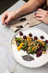 a delicious salad on a plate prepared in a restaurant.
