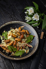a delicious salad on a plate prepared in a restaurant.
