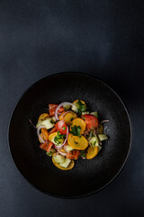 a delicious salad on a plate prepared in a restaurant.
